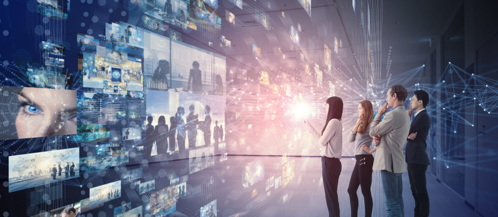Group of people looking stereoscopic display.